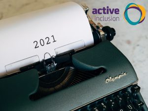 Image of a typewriter with the number 2021 typed on the paper. The Active Inclusion logo appears in the top right hand corner.
